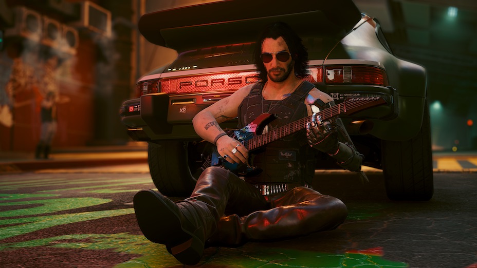Johnny Silverhand playing his guitar beside a car